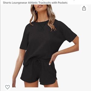 Black athletic track suit with pockets